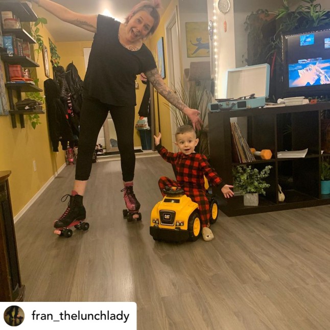 woman on rollerskates next to toddler